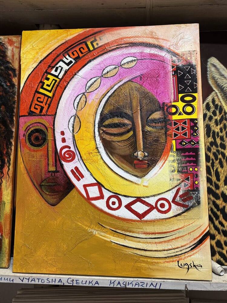 Abstract crescent moon and mask painting in gold and pink by Tanzanian artist Lugsha
