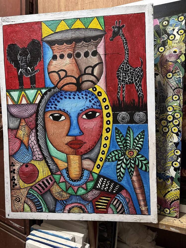 Colorful patterned faces with elephant and giraffe by Tanzanian artist Tonge