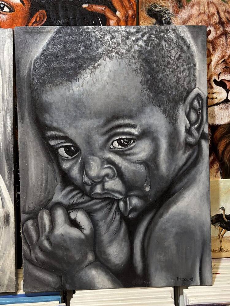 Charcoal portrait of a baby by Tanzanian artist Uzzo